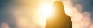 a woman standing face the light.
lgbtqia+, lgbtqia meaning. feeling to healing