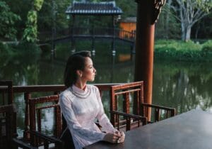 a woman sitting on a park bench Smart goal setting