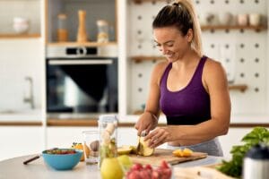 Nutritionist cutting food in the kitchen 